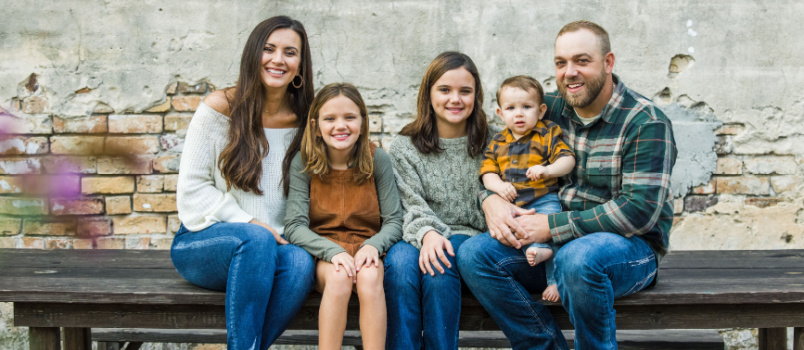 Blended family looking into camera