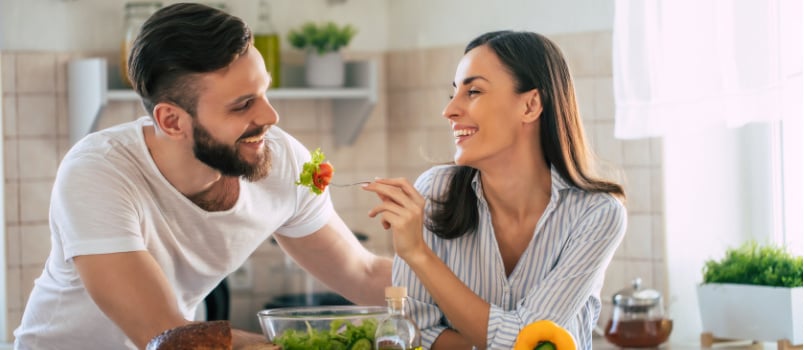 Young couple making lunch together