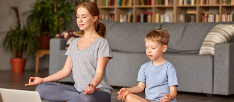 Mother and son doing yoga together 