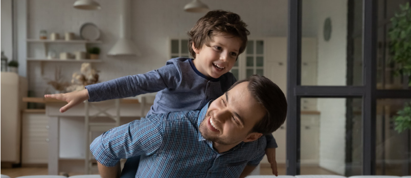 Happy loving daddy playing with son