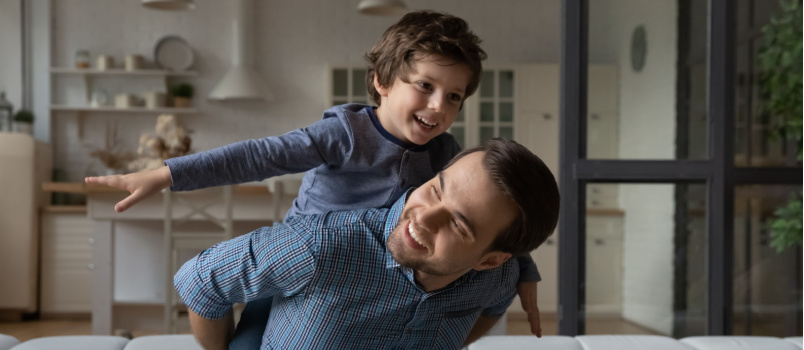 Happy loving daddy affectionate boy playing