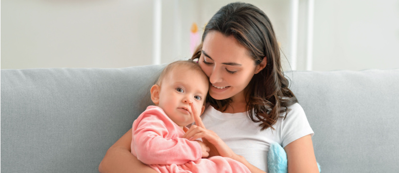 Happy woman with her little baby