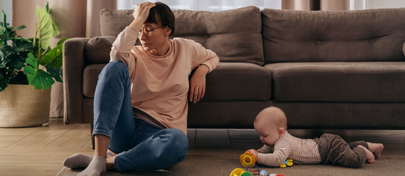 Young woman suffering postnatal depression