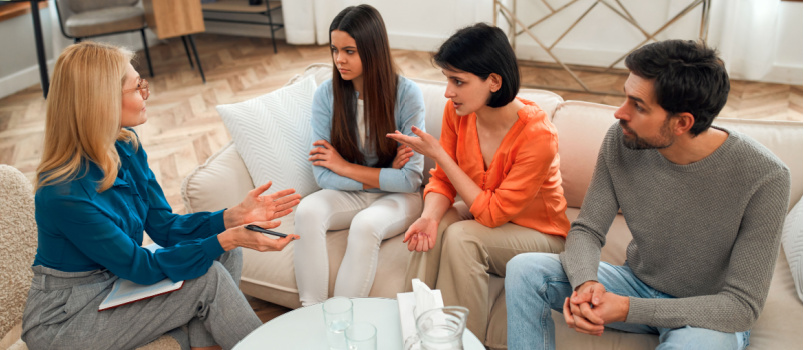 Upset parent and child taking counselling