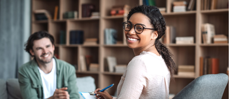 Happy psychologist with patient