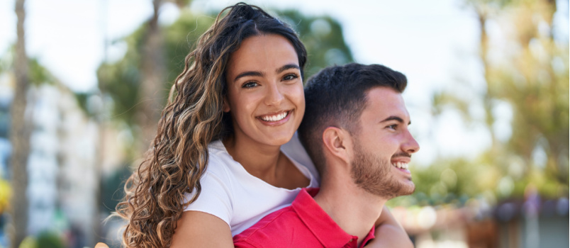 Couple smiling hugging each other