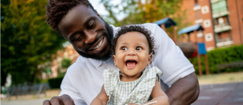 Happy child playing with dad