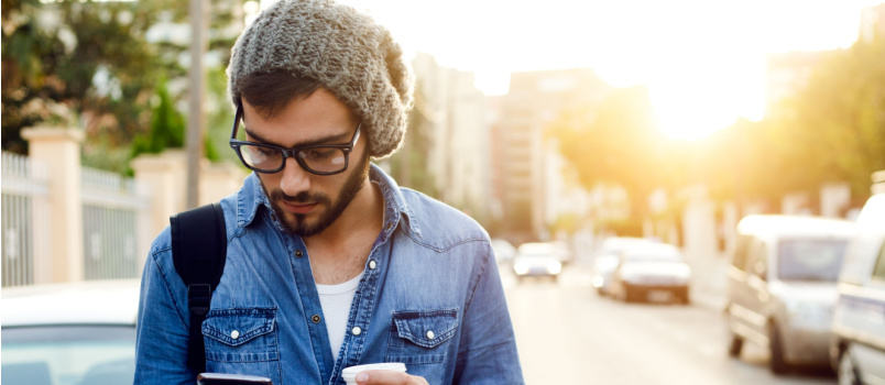 Young man using mobile phone outdoor