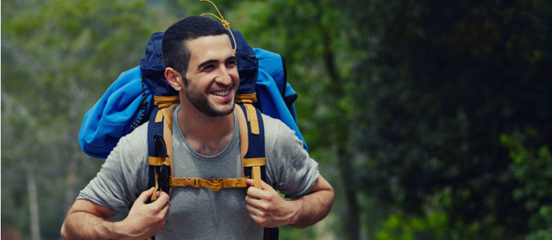 Smiling man going on trek