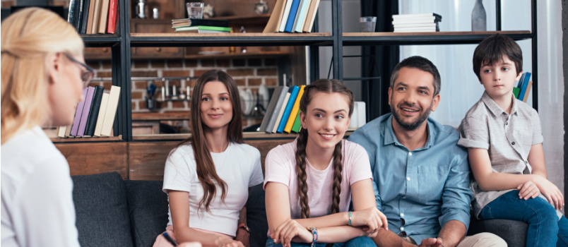 Smiling family on therapy session
