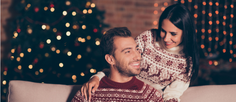 Attractive lady standing beside the young man