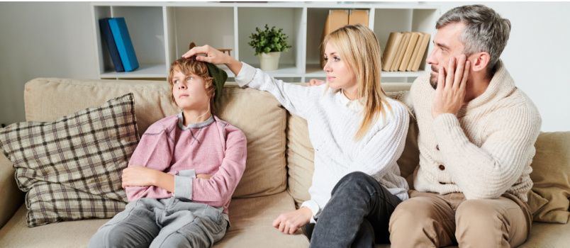 Young parents comforting child