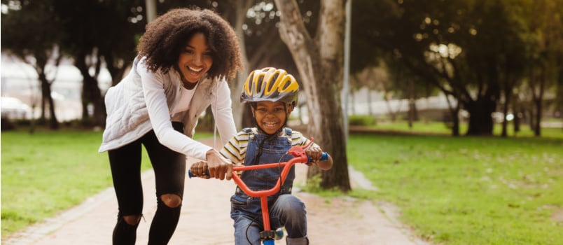 Cute little kid learning bike