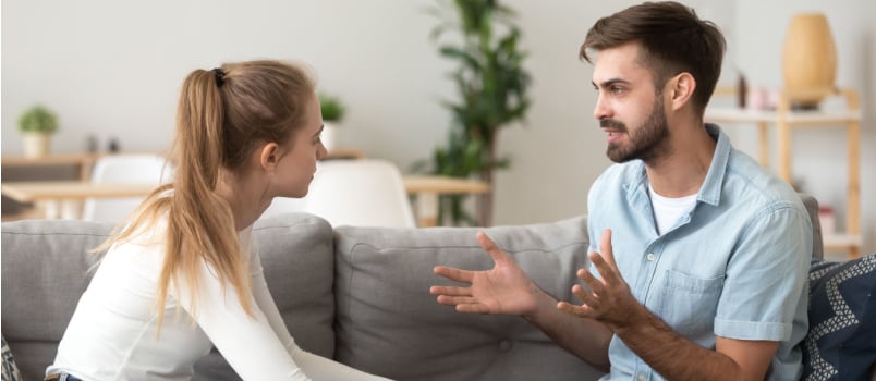 Serious young couple having conflicts