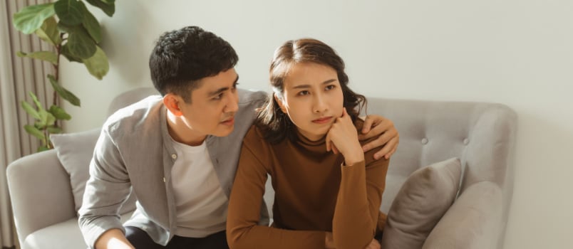 Young man comforting his wife