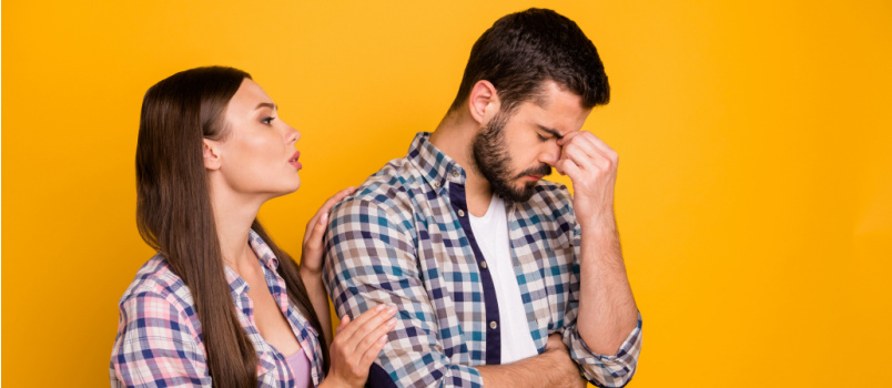 Attractive lady comforting young man
