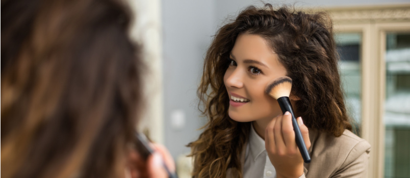 Businesswoman applying make over