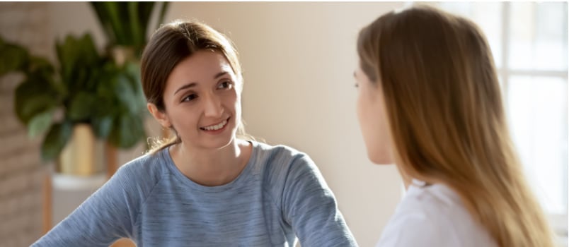 Young woman listening to therapist