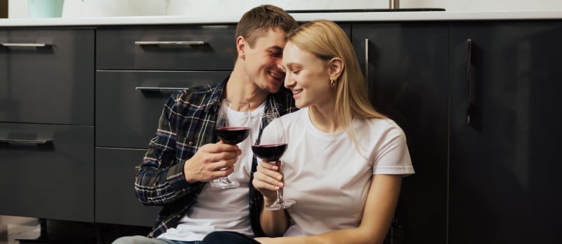 Young couple sitting having drink