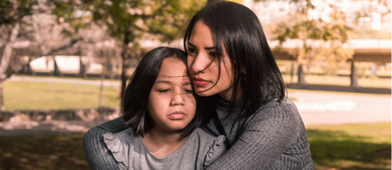 Mother consoling her daughter