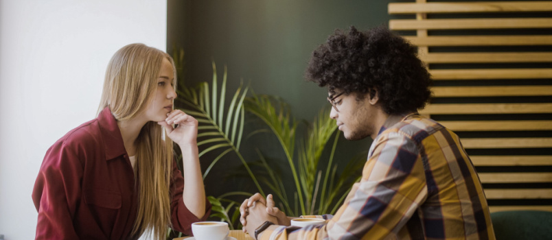 Upset girlfriend having conversation with boyfriend