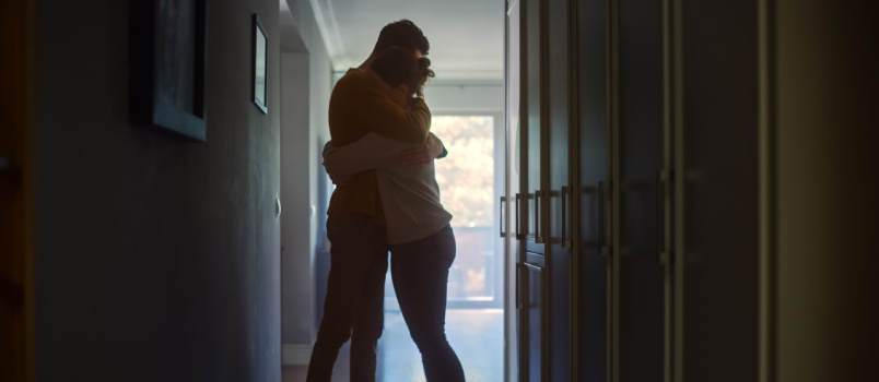 Sad couple comforting each other