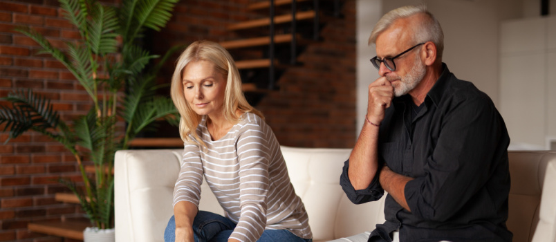 Mature couple signing divorce paper