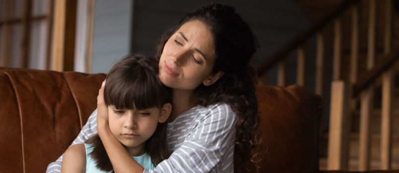 Mother comforting sad daughter