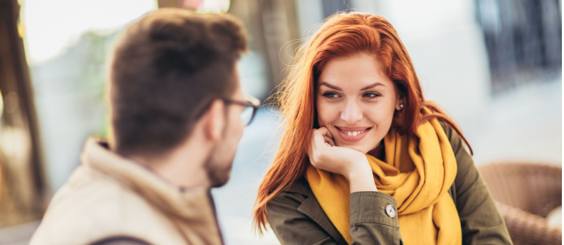 Young loving couple sitting in cafe