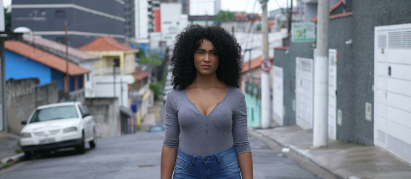 Confident black woman standing outside
