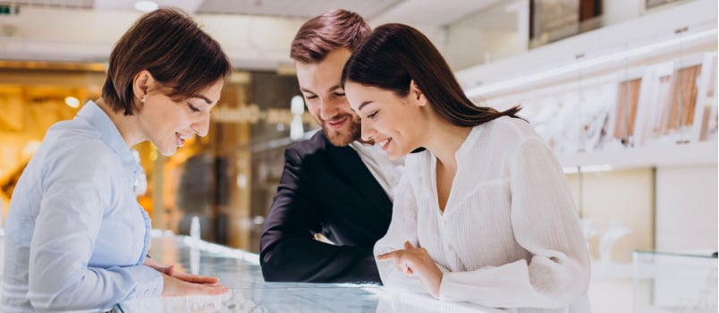 Young couple selecting jewelery
