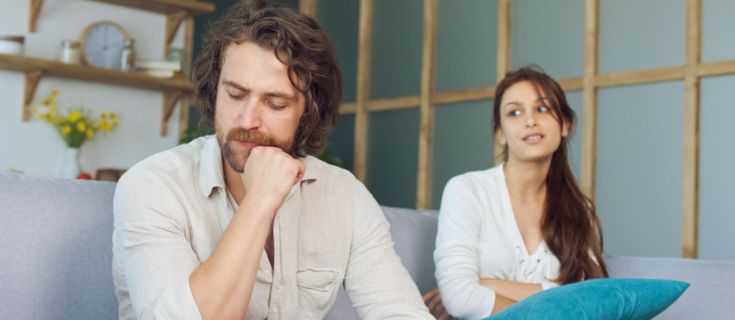 Young couple sitting on couch