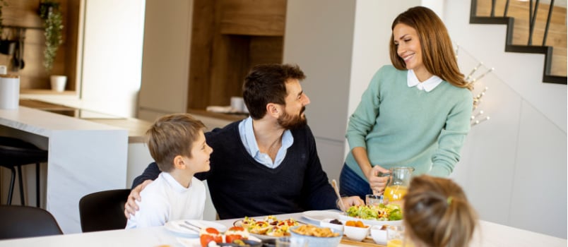 Young mother preparing dinner for family