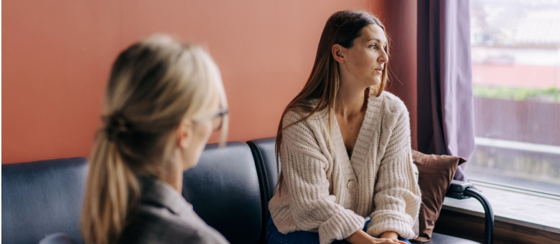 Sad frustrated woman taking to psychologist