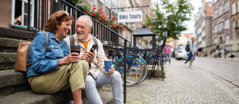 Senior couple sitting on stairs
