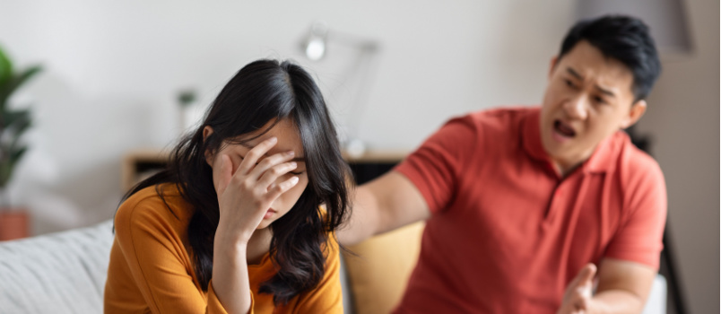 Middle aged man yelling at woman