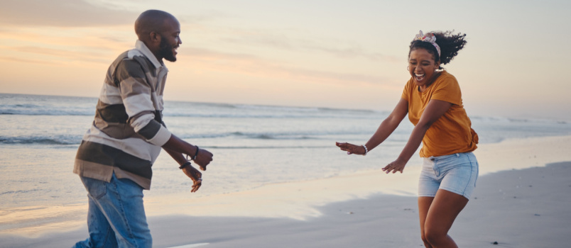 Couple playing on beach