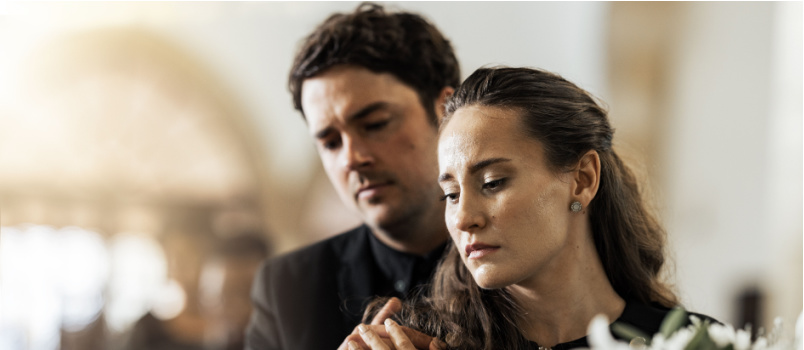 Sad funeral flower couple coffin