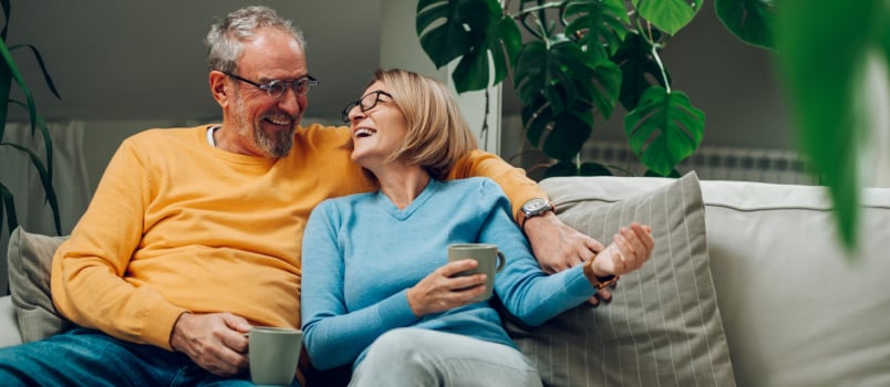 Happy elder couple hugging each other