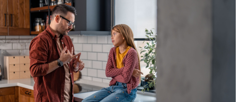 Father having conversation with her daughter