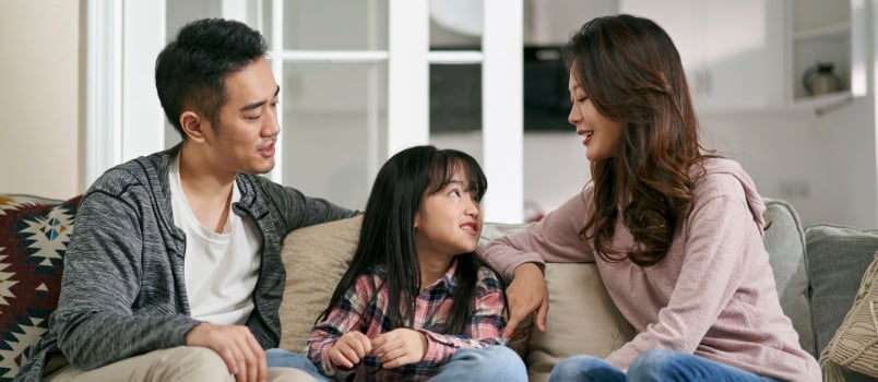 Parents having word with daughter