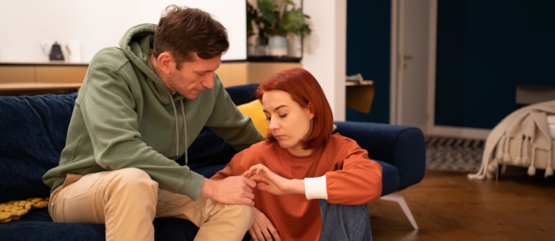 Couple comforting each other