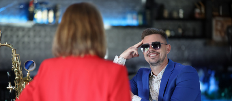 Smiling confident man flirting with woman