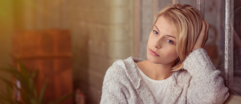 Sad young woman thinking