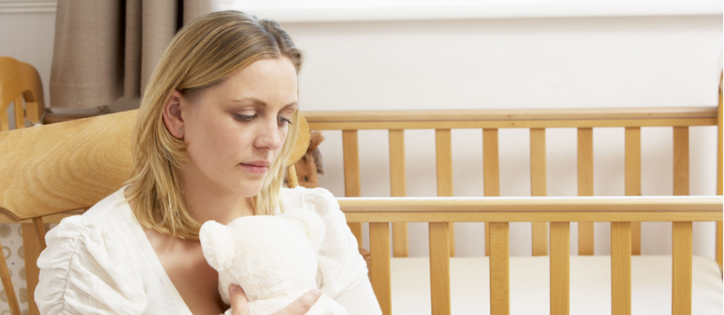 Sad mother sitting alone