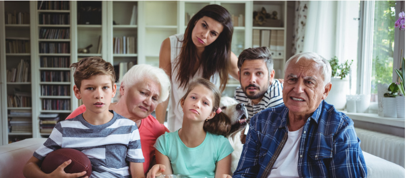 Unhappy multigeneration family watching