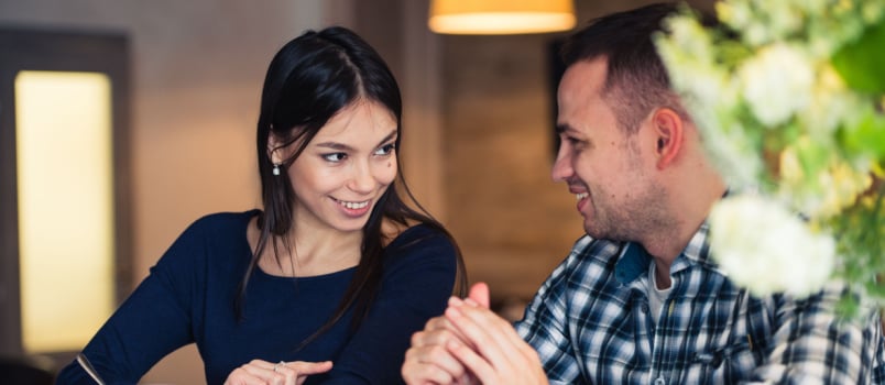 Young couple on a date talking to each other