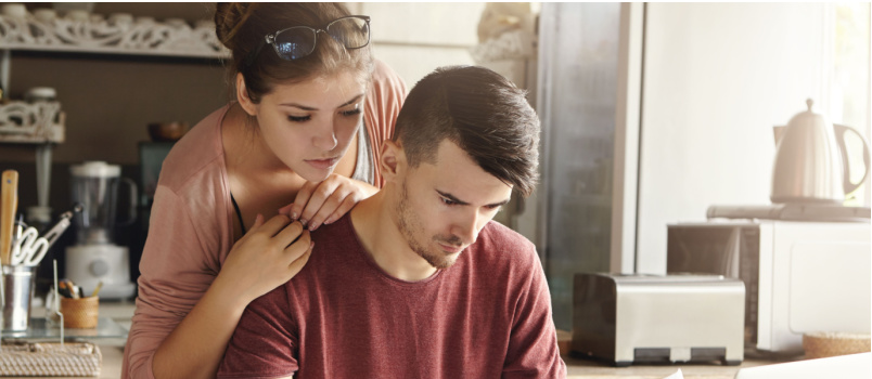 Unhappy couple paying utility bill