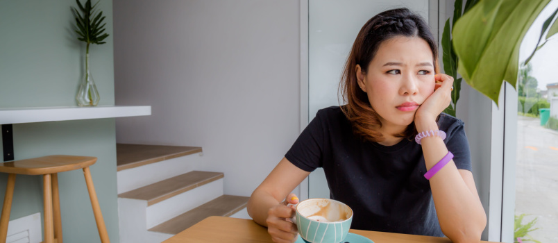 Young woman holding coffee mug