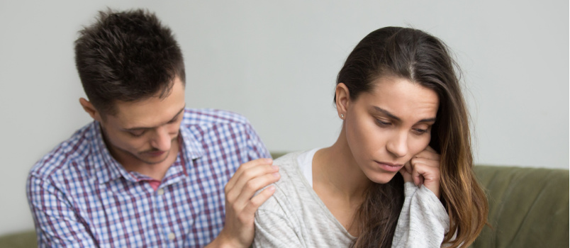 Man comforting sad wife